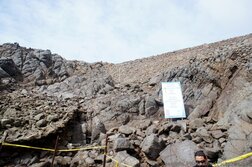 Rock wall with climbing prohibited sign at La Bufadora.jpg