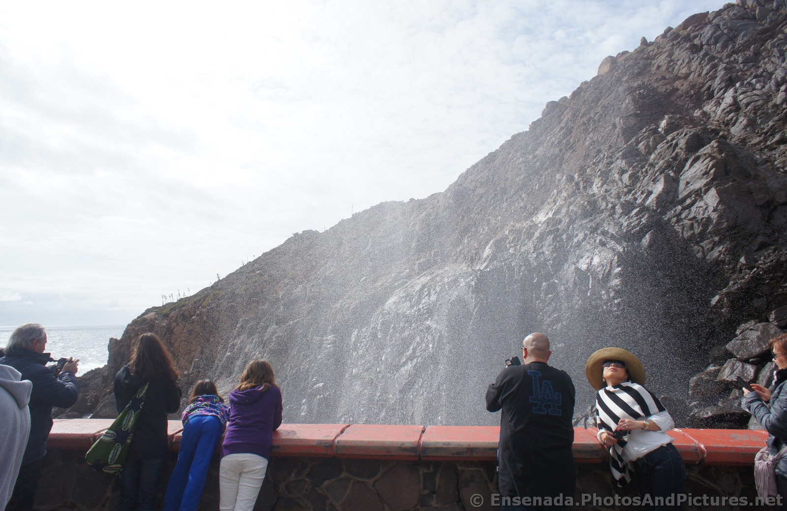 Water mists rise out of the La Bufadora.jpg