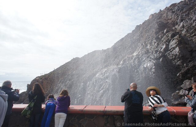 Water mists rise out of the La Bufadora.jpg