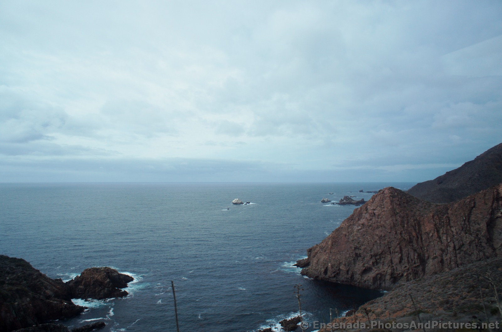 Rocky cliffs on the edge of Bahia Todos Santos bay.jpg